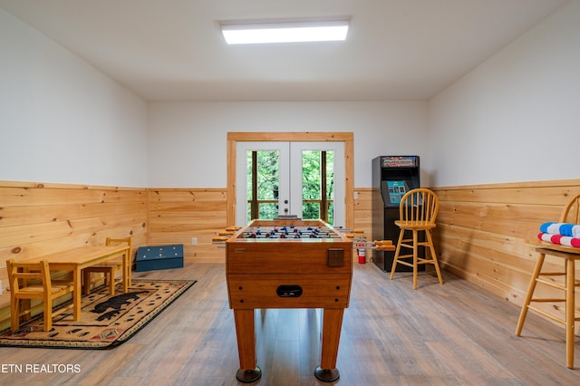 1646 Misty Hollow Way, Gatlinburg, TN 37738 - playroom featuring french doors, wood finished floors, and a wainscoted wall