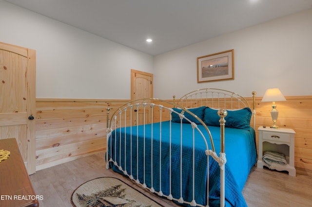 1646 Misty Hollow Way, Gatlinburg, TN 37738 - bedroom with wood finished floors, wooden walls, recessed lighting, and wainscoting