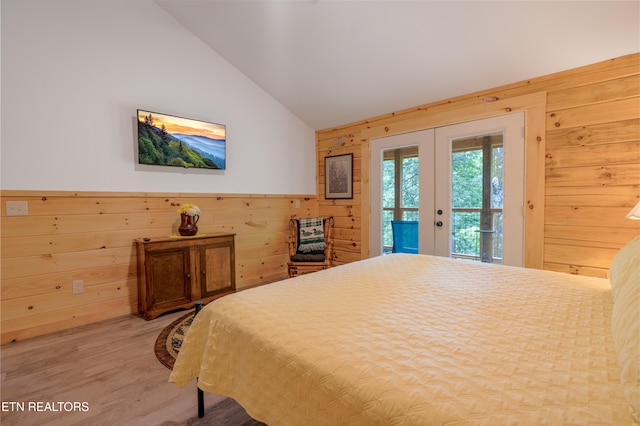 1646 Misty Hollow Way, Gatlinburg, TN 37738 - bedroom with french doors, access to exterior, lofted ceiling, wooden walls, and light wood-type flooring