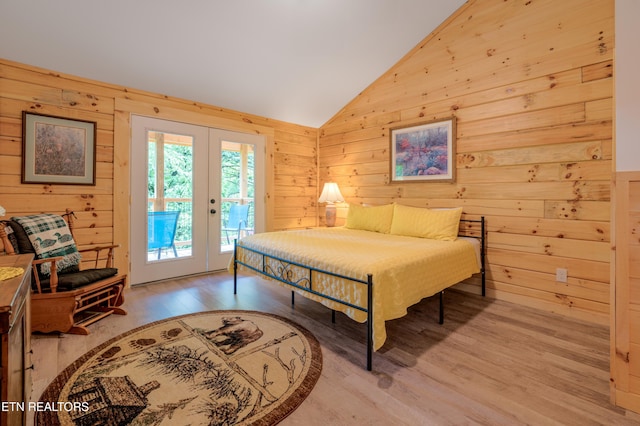 1646 Misty Hollow Way, Gatlinburg, TN 37738 - bedroom with wooden walls, vaulted ceiling, access to exterior, french doors, and wood finished floors