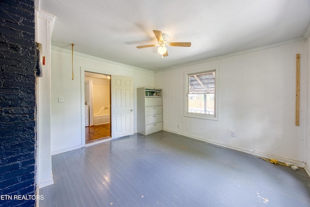7250 Rutledge Pike, Knoxville, TN 37924 - unfurnished bedroom featuring crown molding, wood finished floors, baseboards, a ceiling fan, and a textured ceiling