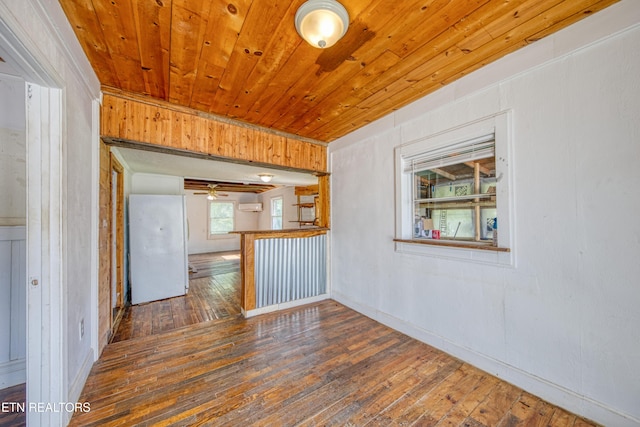 7250 Rutledge Pike, Knoxville, TN 37924 - spare room with hardwood / wood-style flooring, wooden ceiling, a ceiling fan, and a wall mounted air conditioner