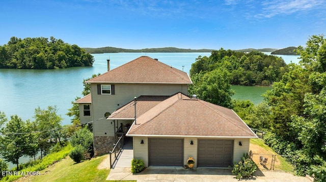3728 Lighthouse Way, Sevierville, TN 37876 - view of front of home featuring a water view, an attached garage, and a gate