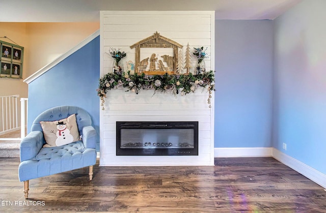 812 Greene Meadow Dr, Talbott, TN 37877 - sitting room with a glass covered fireplace, wood finished floors, and baseboards