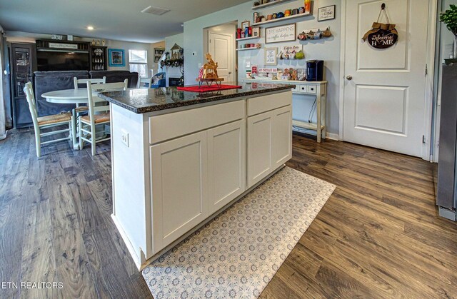 812 Greene Meadow Dr, Talbott, TN 37877 - kitchen with white cabinets, dark wood finished floors, a center island, and dark stone countertops
