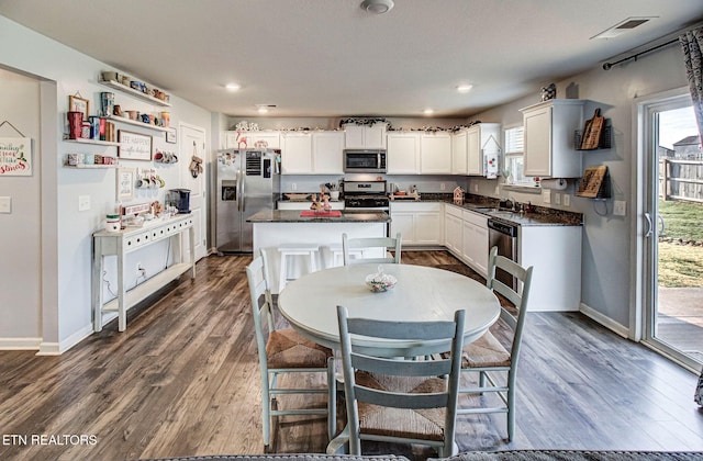 812 Greene Meadow Dr, Talbott, TN 37877 - kitchen with appliances with stainless steel finishes, dark countertops, baseboards, dark wood-style flooring, and recessed lighting