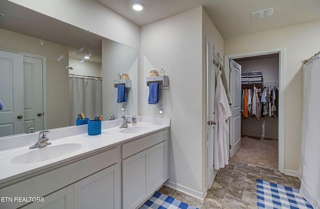 812 Greene Meadow Dr, Talbott, TN 37877 - full bathroom featuring double vanity, baseboards, a spacious closet, and curtained shower