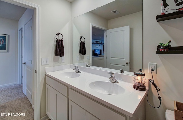 812 Greene Meadow Dr, Talbott, TN 37877 - bathroom with double vanity, baseboards, and toilet