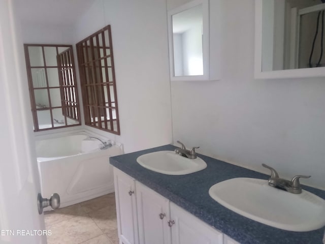 915 Porter Kite Rd, Mohawk, TN 37810 - full bath featuring a bath, double vanity, and tile patterned floors