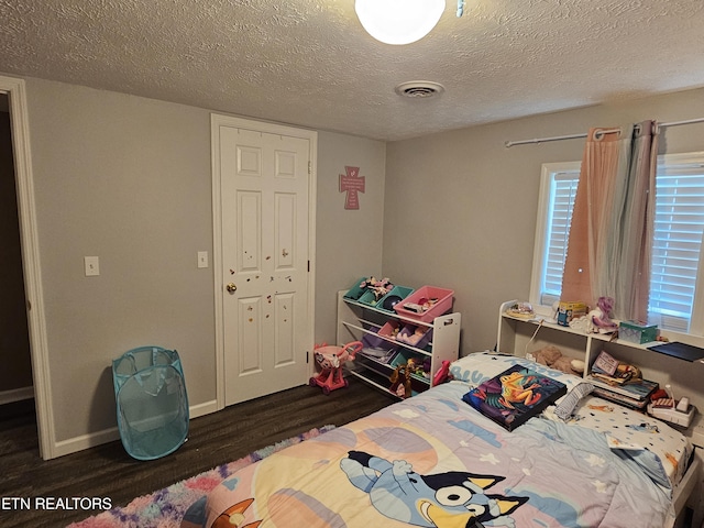717 Cedar Fork Rd, Tazewell, TN 37879 - bedroom with wood finished floors, a textured ceiling, and baseboards