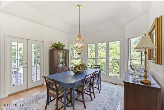 4151 Cave Springs Rd, Tazewell, TN 37879 - dining area with french doors, light wood-type flooring, and a chandelier