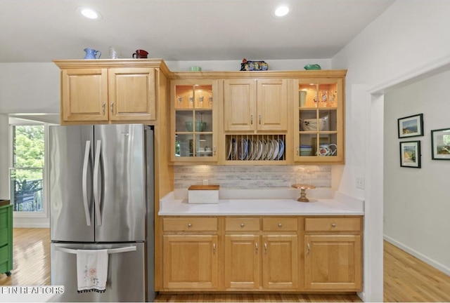 4151 Cave Springs Rd, Tazewell, TN 37879 - kitchen with freestanding refrigerator, light wood-type flooring, decorative backsplash, light countertops, and recessed lighting