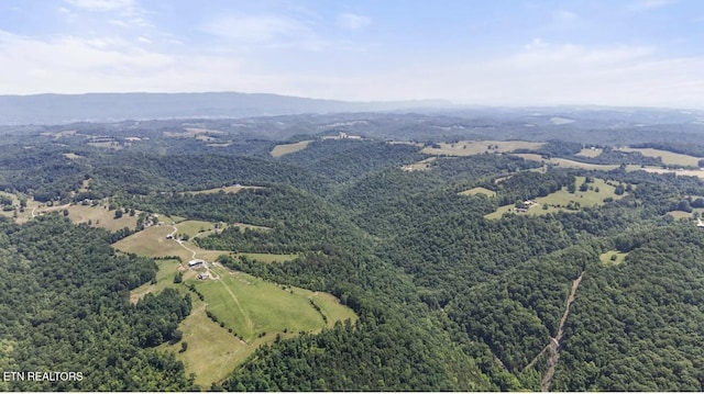 4151 Cave Springs Rd, Tazewell, TN 37879 - drone / aerial view of a heavily wooded area and a mountain backdrop