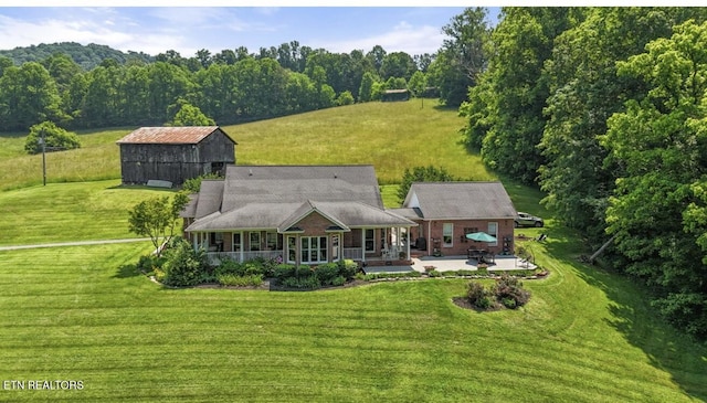 4151 Cave Springs Rd, Tazewell, TN 37879 - rear view of house featuring a yard, an outdoor structure, and covered porch