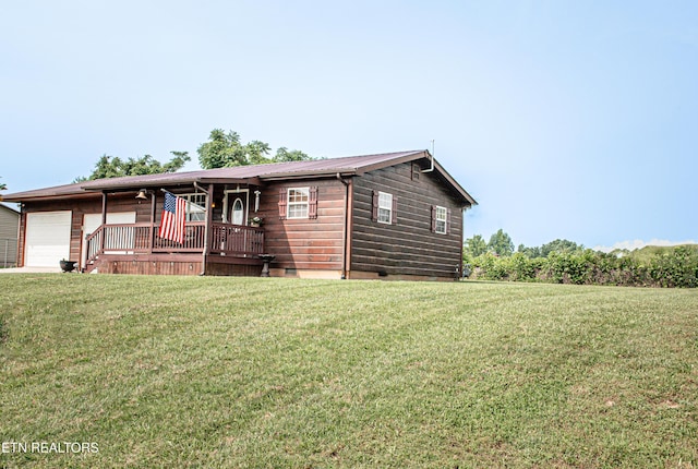 2277 Old Wolf River Rd, Jamestown, TN 38556 - view of front of home featuring covered porch, a garage, a front lawn, a metal roof, and crawl space