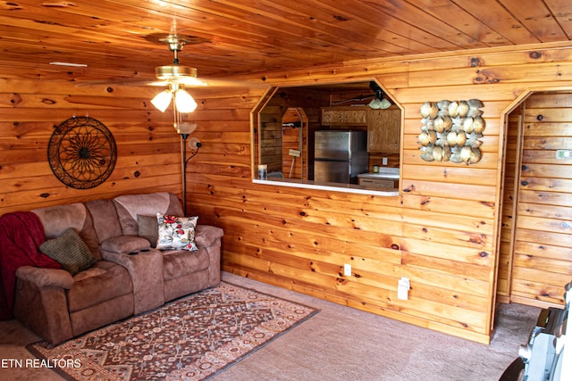 2277 Old Wolf River Rd, Jamestown, TN 38556 - carpeted living area featuring wood ceiling, ceiling fan, and wood walls