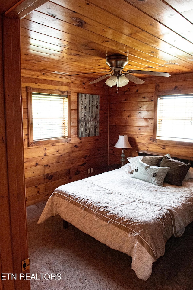2277 Old Wolf River Rd, Jamestown, TN 38556 - bedroom featuring multiple windows, wood ceiling, and wooden walls