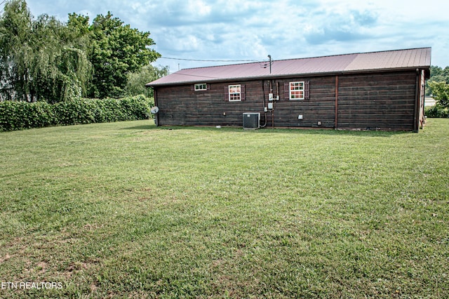 2277 Old Wolf River Rd, Jamestown, TN 38556 - back of property featuring a yard and a metal roof