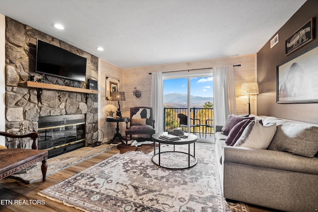 3710 Weber Rd Unit E107, Gatlinburg, TN 37738 - living area with wood finished floors, a fireplace, and wooden walls