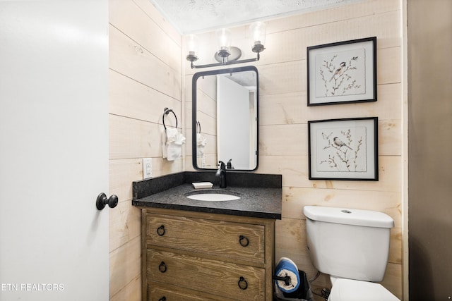 3710 Weber Rd Unit E107, Gatlinburg, TN 37738 - bathroom with vanity, toilet, and wood walls