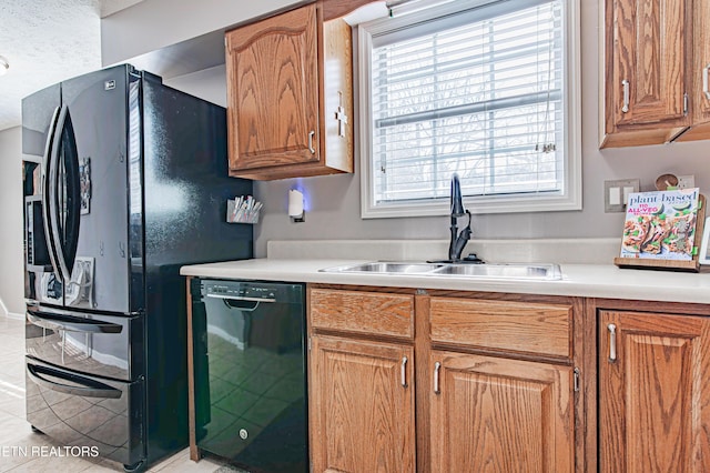 117 Maltese Ln, Oak Ridge, TN 37830 - kitchen featuring black appliances, a sink, light countertops, and tile patterned floors