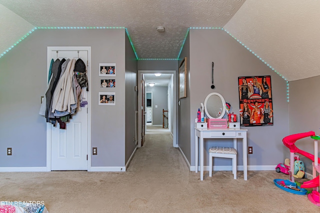 117 Maltese Ln, Oak Ridge, TN 37830 - rec room with a textured ceiling, carpet flooring, lofted ceiling, and baseboards