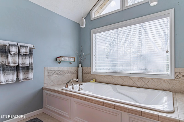 117 Maltese Ln, Oak Ridge, TN 37830 - bathroom featuring vaulted ceiling, a garden tub, and healthy amount of natural light