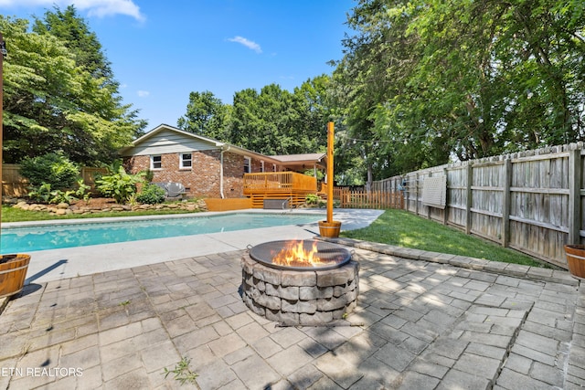 9005 Carlton Cir, Knoxville, TN 37922 - view of pool with a deck, an outdoor fire pit, a fenced backyard, and a patio