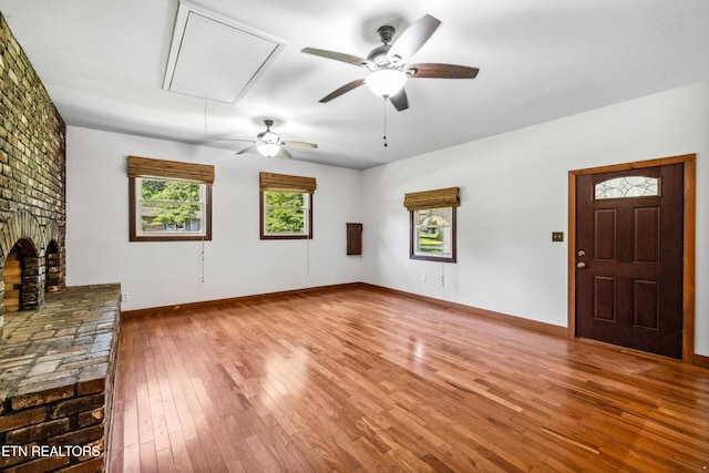 9005 Carlton Cir, Knoxville, TN 37922 - unfurnished living room with attic access, wood-type flooring, ceiling fan, and baseboards