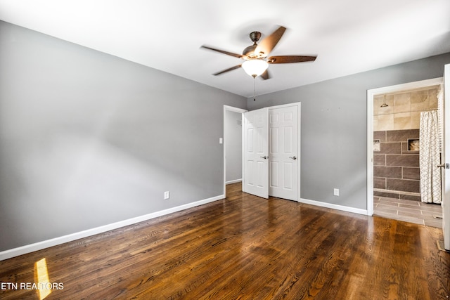 9005 Carlton Cir, Knoxville, TN 37922 - unfurnished bedroom featuring baseboards, wood finished floors, connected bathroom, and ceiling fan