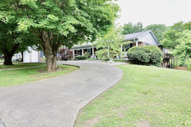 2645 Mountain View Dr, Morristown, TN 37814 - obstructed view of property featuring curved driveway and a front yard