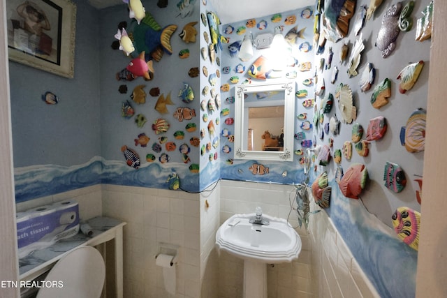 2645 Mountain View Dr, Morristown, TN 37814 - bathroom with tile walls, wainscoting, toilet, and wallpapered walls