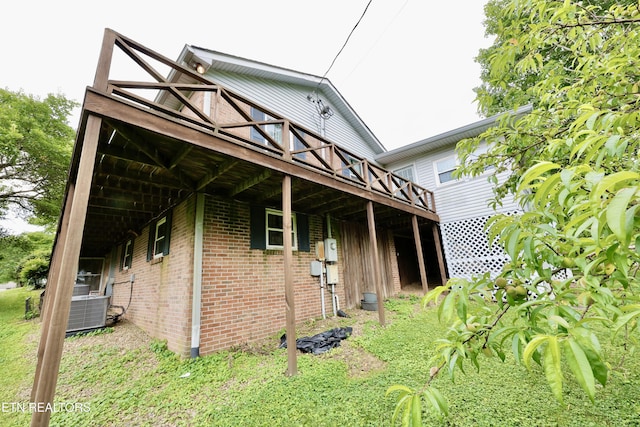 2645 Mountain View Dr, Morristown, TN 37814 - view of side of property featuring a wooden deck, brick siding, and central air condition unit