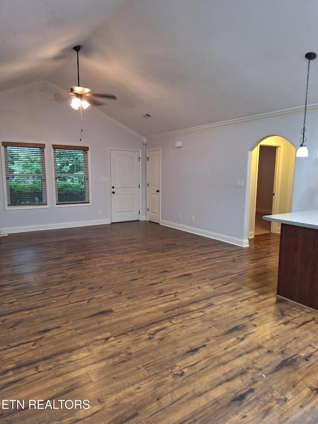 7739 Applecross Rd, Corryton, TN 37721 - unfurnished living room with ceiling fan, arched walkways, dark wood-style flooring, crown molding, and vaulted ceiling