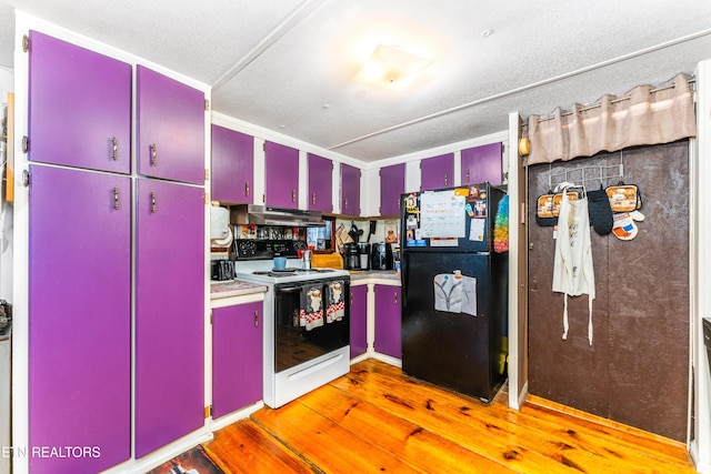 1069 Bryan View Rd, Sevierville, TN 37862 - kitchen featuring red cabinetry, freestanding refrigerator, white range with electric cooktop, under cabinet range hood, and light wood finished floors