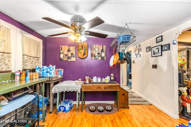 1069 Bryan View Rd, Sevierville, TN 37862 - dining area featuring wood finished floors, ceiling fan, and baseboards