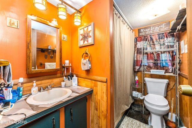 1069 Bryan View Rd, Sevierville, TN 37862 - bathroom with a textured ceiling, vanity, toilet, and a shower with shower curtain