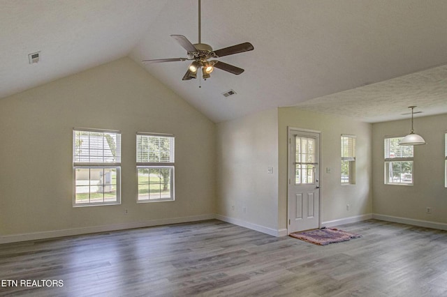 1505 Cypress View Ct, Sevierville, TN 37862 - unfurnished living room with ceiling fan, wood finished floors, vaulted ceiling, and baseboards
