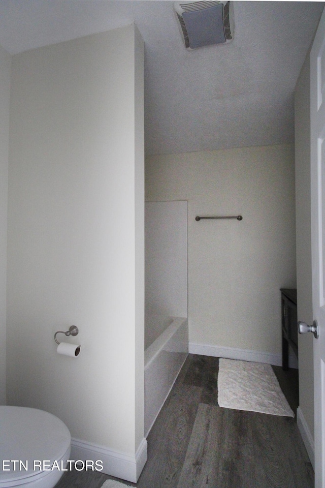 1505 Cypress View Ct, Sevierville, TN 37862 - full bath with a tub to relax in, toilet, wood finished floors, baseboards, and a shower