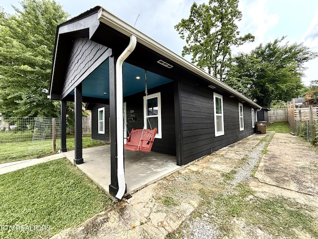 304 Douglas Ave, Knoxville, TN 37921 - view of side of home featuring a patio