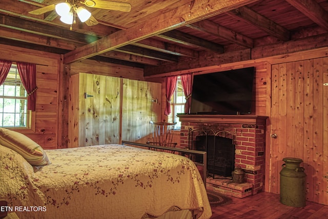 147 Akers Chapel, Jamestown, TN 38556 - bedroom featuring wooden walls, wood finished floors, wooden ceiling with exposed beams, and a brick fireplace