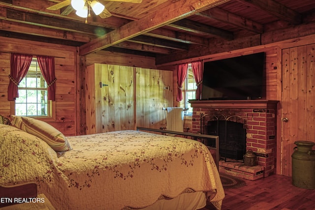 147 Akers Chapel, Jamestown, TN 38556 - bedroom featuring wood walls, wood finished floors, a fireplace, and wood ceiling with exposed beams