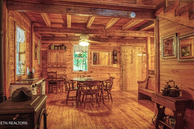 147 Akers Chapel, Jamestown, TN 38556 - dining space with wooden walls, a ceiling fan, light wood-type flooring, and wooden ceiling with exposed beams