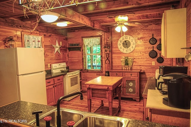 147 Akers Chapel, Jamestown, TN 38556 - kitchen with white appliances, wood finished floors, wooden walls, a ceiling fan, and dark countertops