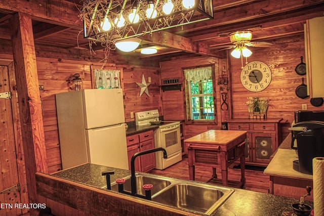 147 Akers Chapel, Jamestown, TN 38556 - kitchen with white appliances, wood walls, beamed ceiling, dark wood-style flooring, and a ceiling fan