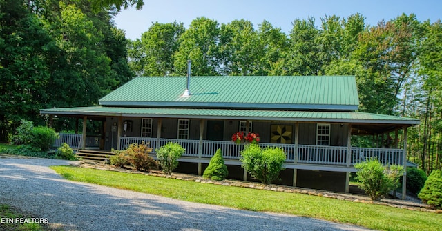 147 Akers Chapel, Jamestown, TN 38556 - farmhouse-style home with covered porch and metal roof
