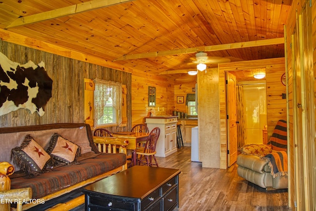 147 Akers Chapel, Jamestown, TN 38556 - living room featuring wooden ceiling with exposed beams, wooden walls, wood finished floors, and a ceiling fan