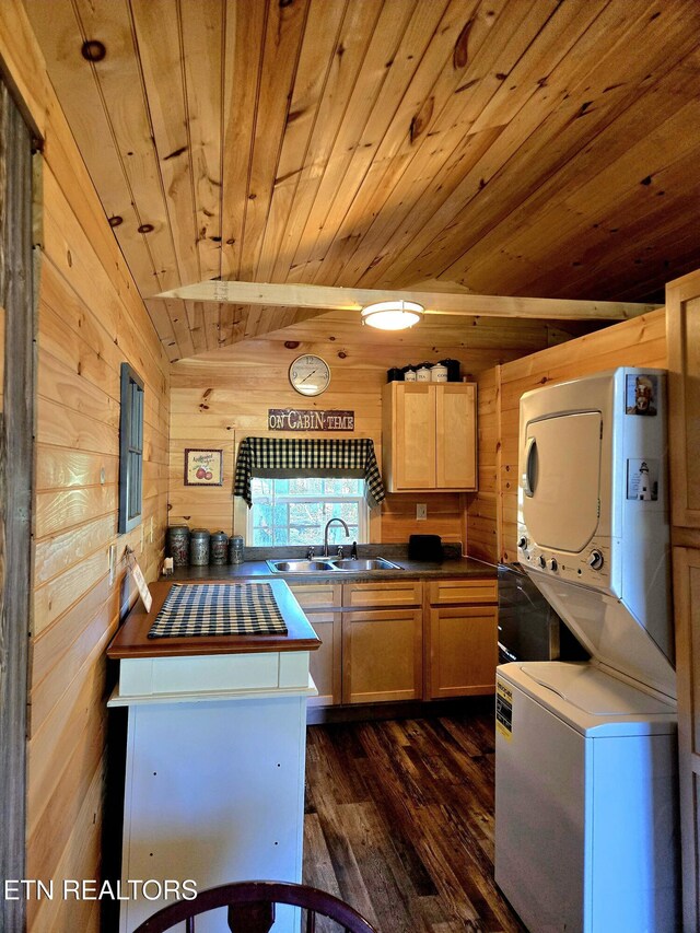 147 Akers Chapel, Jamestown, TN 38556 - kitchen with stacked washer / dryer, a sink, wood ceiling, dark wood-type flooring, and wooden walls