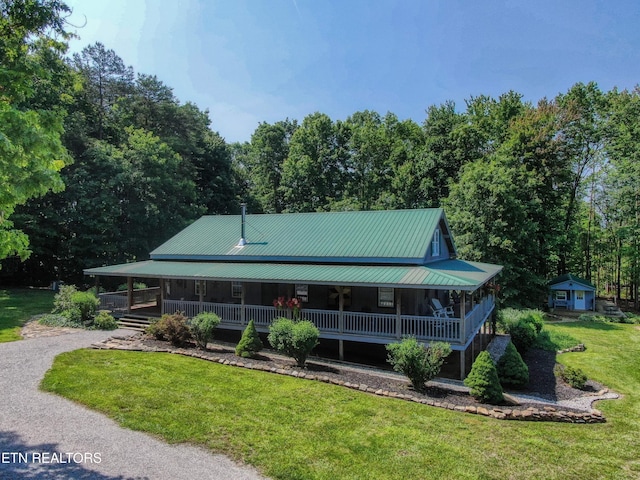 147 Akers Chapel, Jamestown, TN 38556 - rear view of house featuring a porch, a yard, metal roof, and gravel driveway