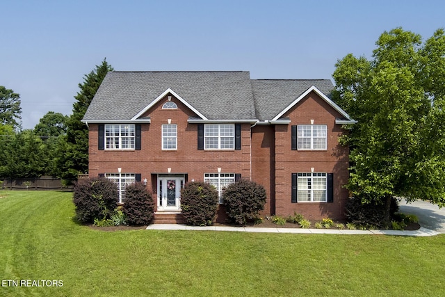1739 Inverness Dr, Maryville, TN 37801 - colonial home featuring a front yard, brick siding, and roof with shingles